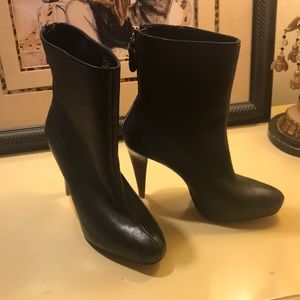 Black heeled Calvin Klein bootie, hidden platform.